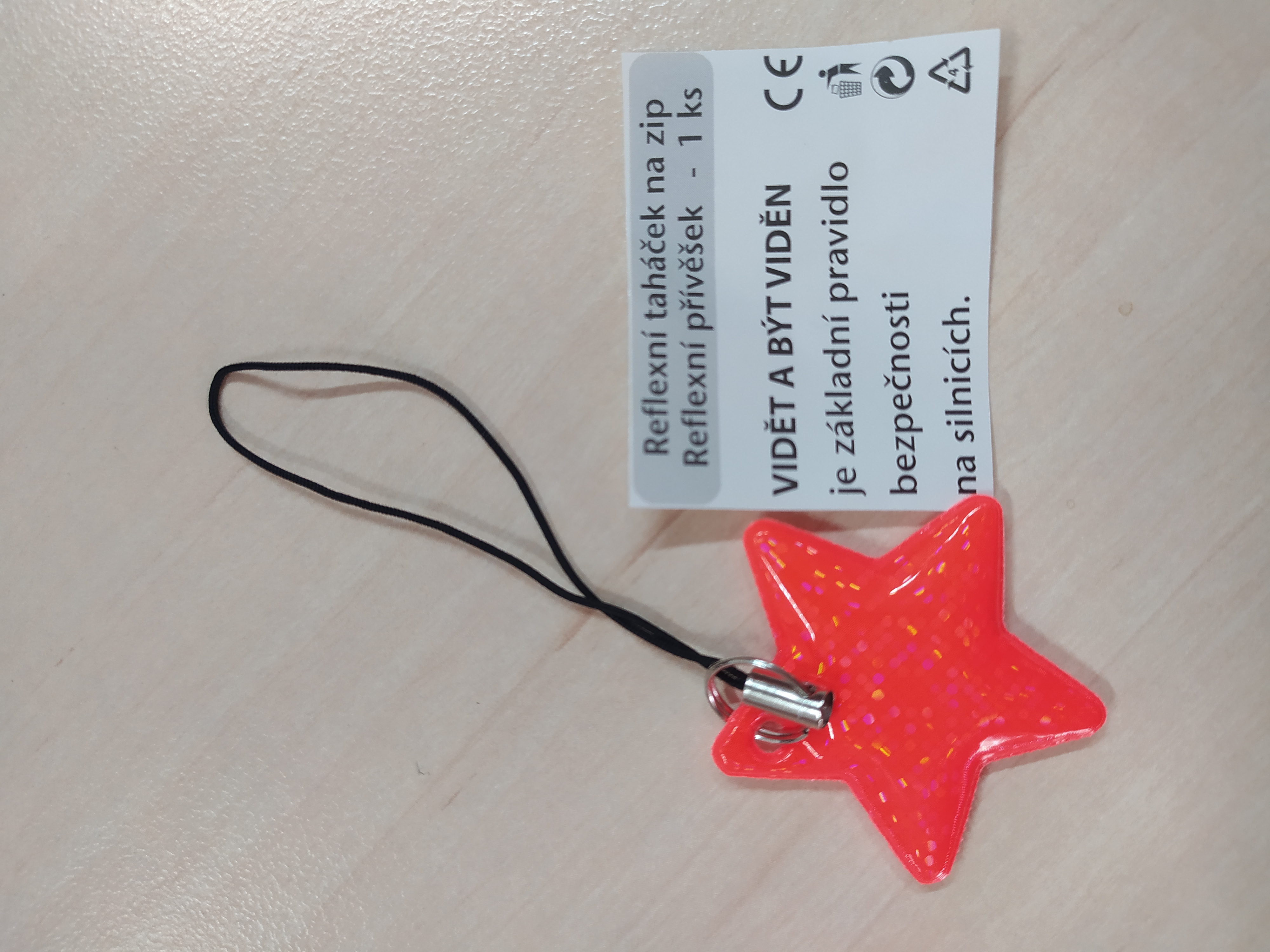 Reflexní taháček na zip oranžová hvězdička