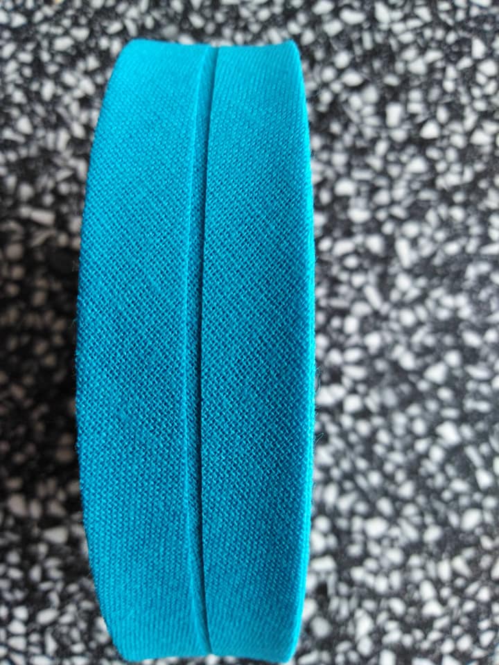 Šikmý proužek 25 mm bavlněný založený tyrkys
